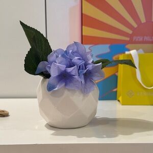White Ceramic Vase with Purple Flowers